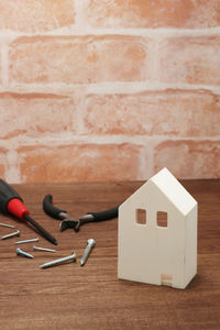 Close-up of stuffed toy on table against wall