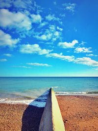 Concrete groyne at hove beach against sky