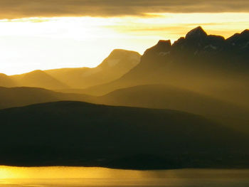 Scenic view of mountains against sky during sunset