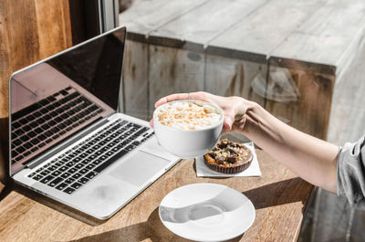 Woman having breakfast at home