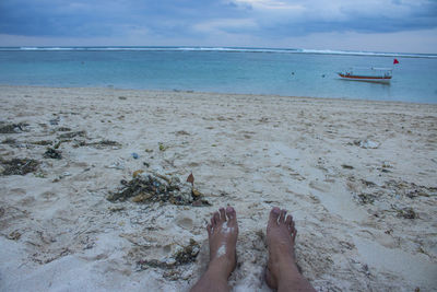 Low section of person on beach