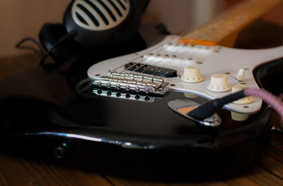 Close-up of guitar on table