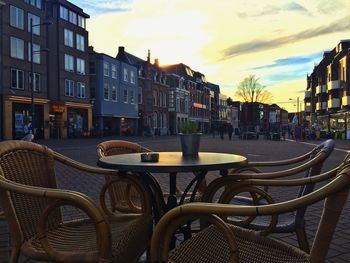 Buildings in city at sunset