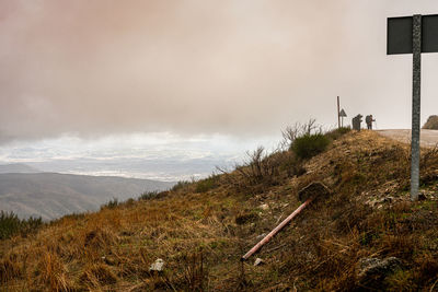 A peregrino walking along the camino de santiago during a rainy day. december 2019