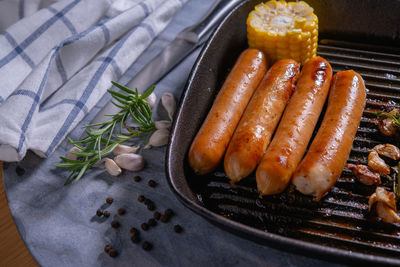 High angle view of meat on barbecue grill