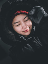 Portrait of young man sleeping in winter