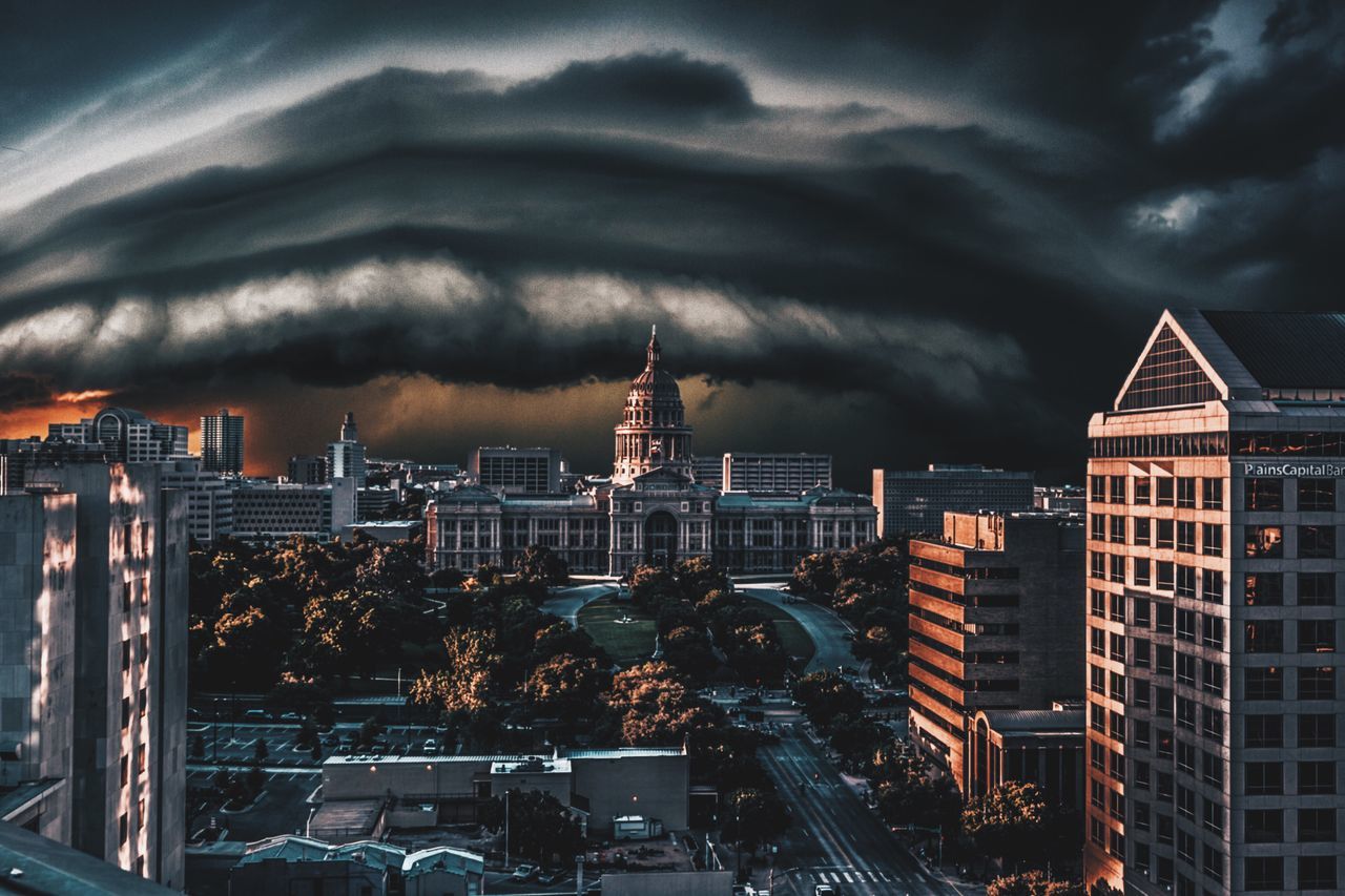 building exterior, architecture, built structure, city, sky, cloud - sky, cityscape, cloudy, illuminated, storm cloud, residential building, skyscraper, modern, weather, overcast, night, building, city life, tall - high, residential district