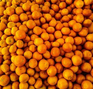 Full frame shot of oranges at market stall