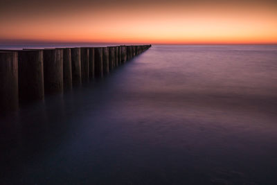 Scenic view of sea against sky at sunset