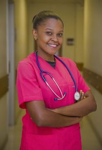 Portrait of a smiling young nurse with a stethoscope 