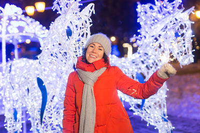 Midsection of woman standing in snow