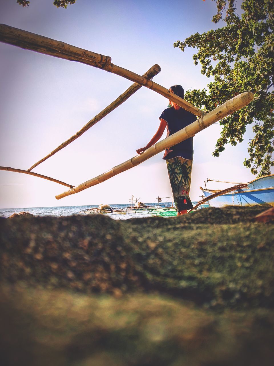 LOW ANGLE VIEW OF PERSON CLIMBING ON STREET