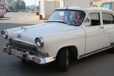 Vintage car parked on road