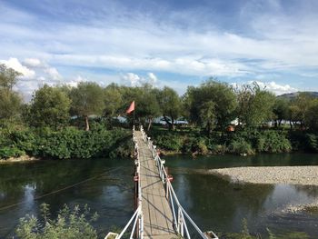 Bridge over river against sky