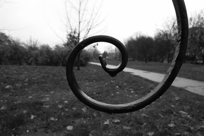 Close-up of sunglasses on side-view mirror