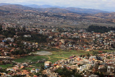 High angle view of townscape and mountains