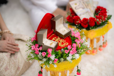 View of red roses holding bouquet