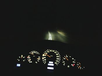 Close-up of illuminated lighting equipment