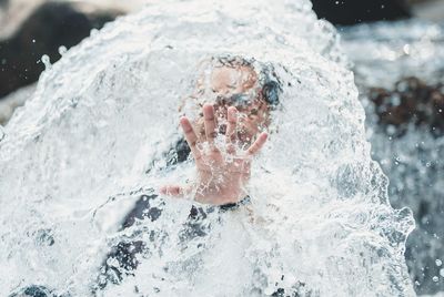 Portrait of man swimming in pool