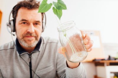 Portrait of man holding drink