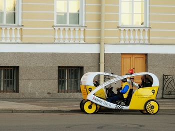 Yellow cart on building