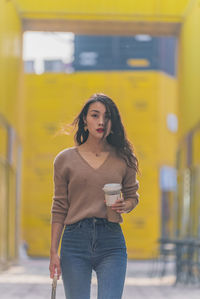 Young woman standing in city