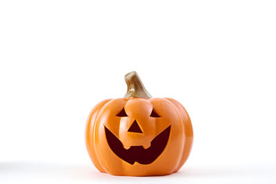 Close-up of jack o lantern against white background