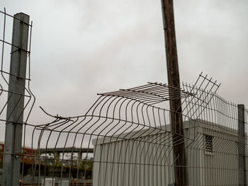 Low angle view of factory against sky