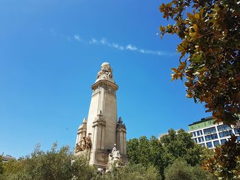 Low angle view of built structure against blue sky