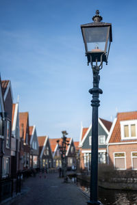 Low angle view of street light against sky