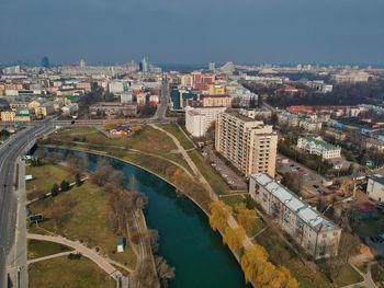 High angle view of river amidst buildings in city