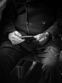 Midsection of man standing on floor