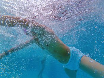 Man swimming in pool