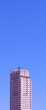 Low angle view of building against blue sky