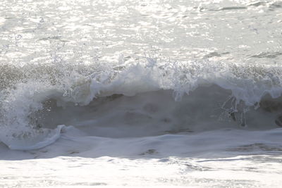 Sea waves splashing on shore