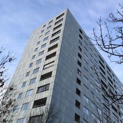 Low angle view of office building against sky