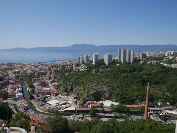 High angle view of buildings in city against clear sky