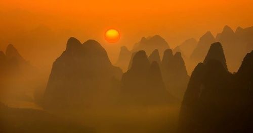 Scenic view of mountains at sunset