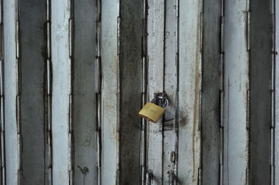 Close-up of padlock on metal door