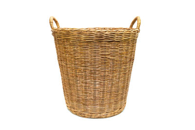 Close-up of wicker basket against white background