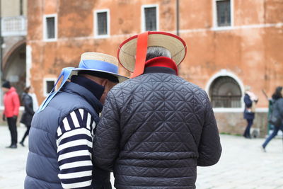 Rear view of couple walking outdoors