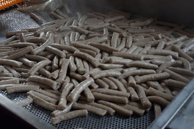 High angle view of roasted coffee beans in wicker basket