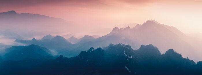 Scenic view of mountains against sky during sunset