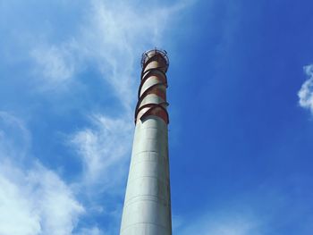 Low angle view of smoke stack against sky