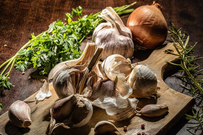 High angle view of garlic on cutting board