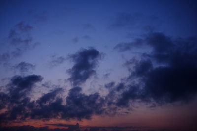 Low angle view of dramatic sky at sunset