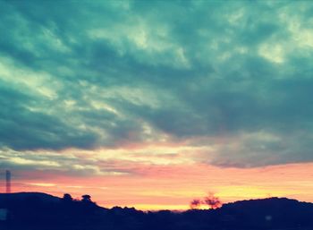 Low angle view of dramatic sky during sunset