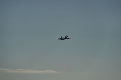 Low angle view of airplane flying in sky