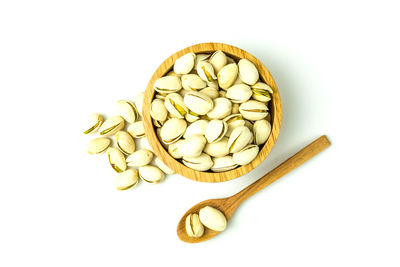Directly above shot of bread in bowl against white background
