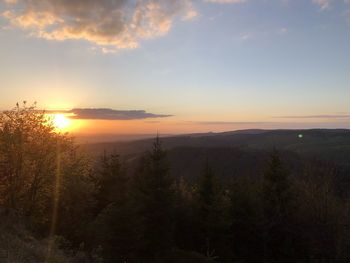 Scenic view of landscape against sky during sunset